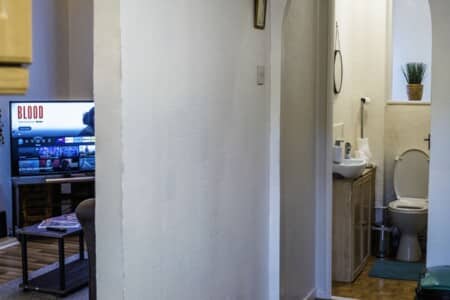 lodginet spacious white house living room and toilet